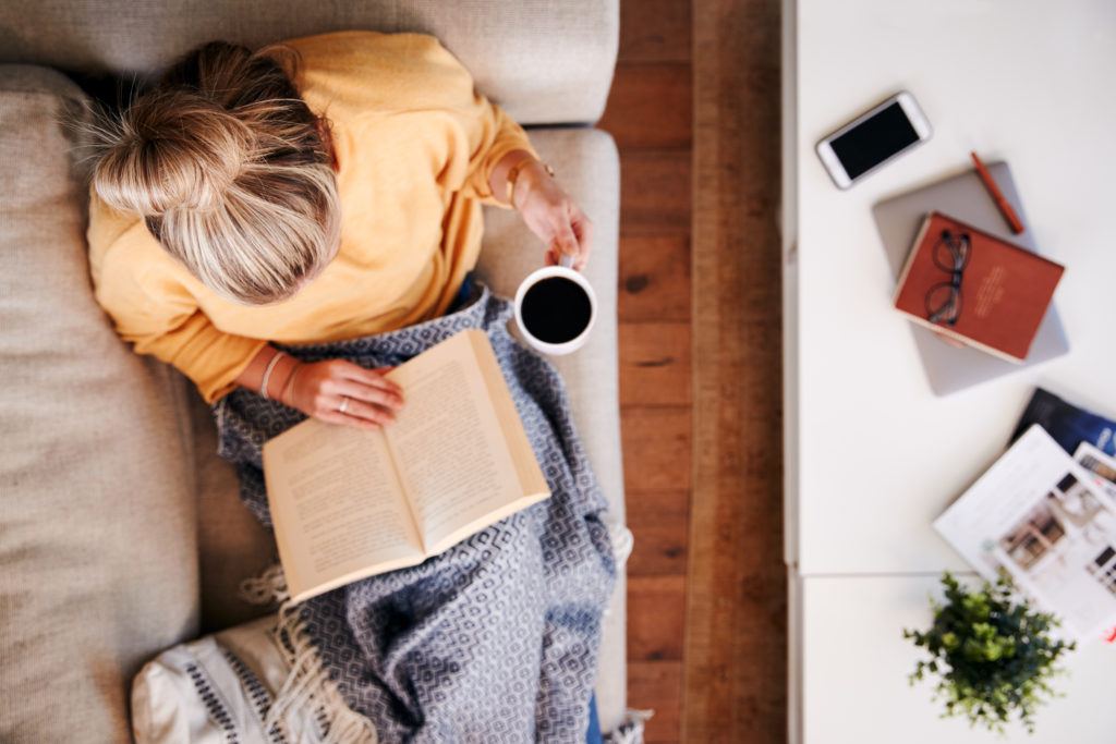 A carer relaxing with a cup of tea as a strategy to combat carer burnout. 