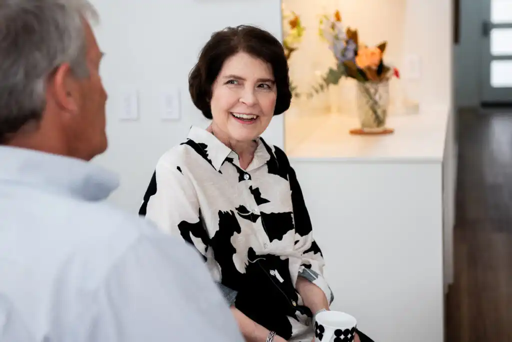 Andria sitting, talking and smiling