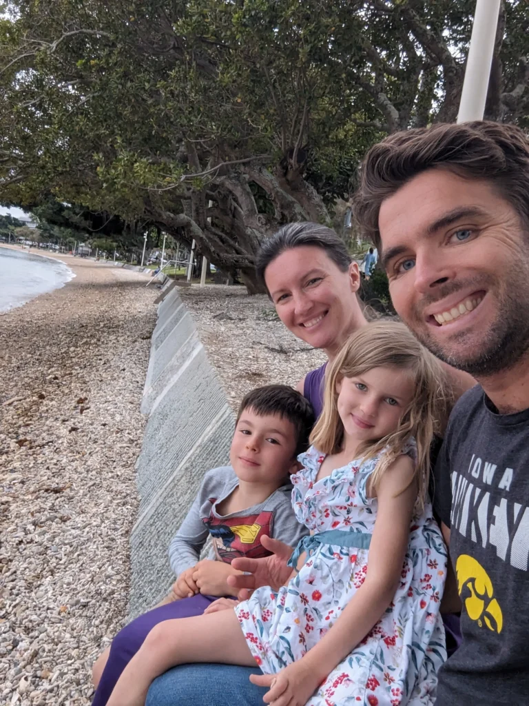 Travis, Emily and their family taking a photo